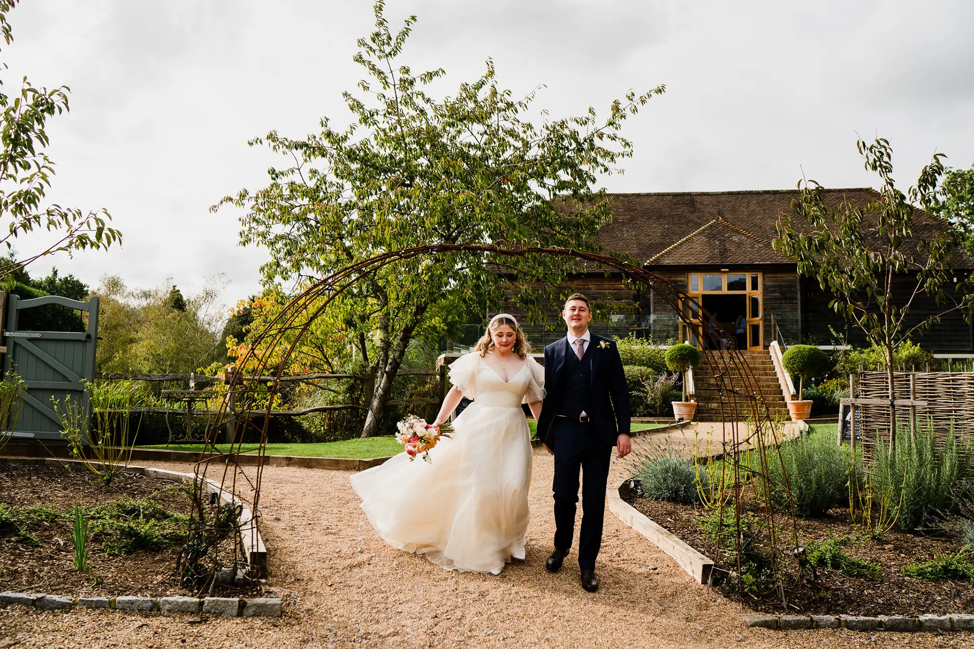 Brookfield Barn autumn wedding couple in gardens