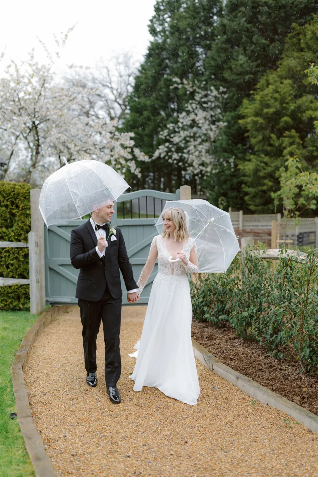 Brookfield Barn couple walking in gardens spring wedding