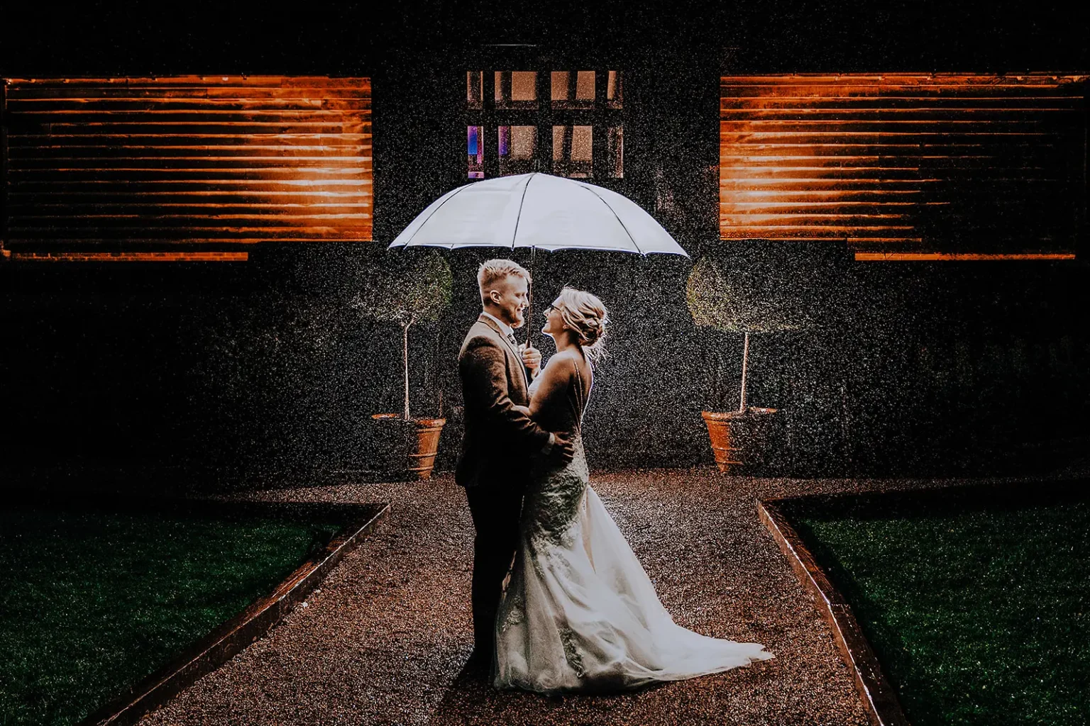 Brookfield Barn wedding venue couple under umbrella in Autumn